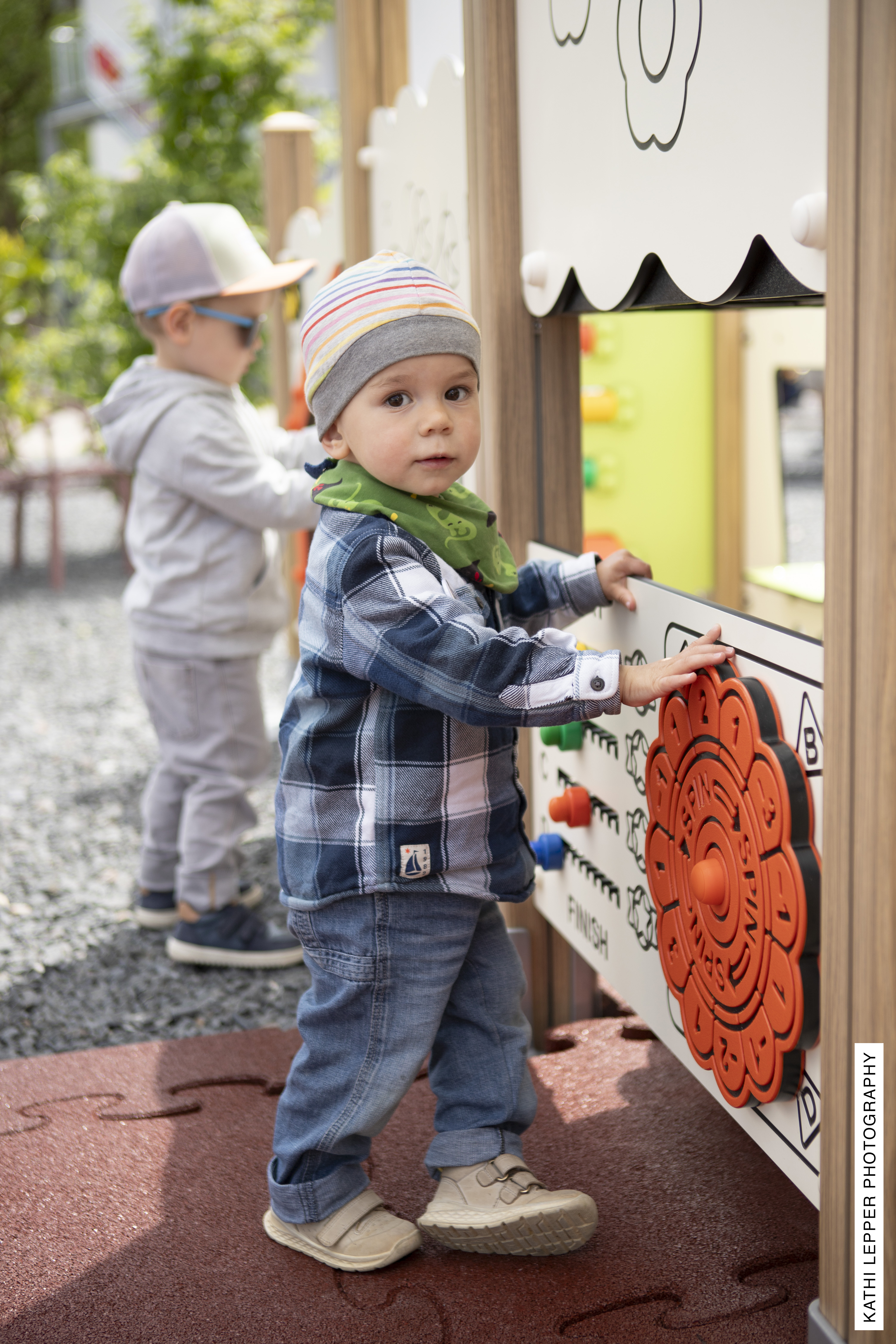 Child engaged with Qualiterra outdoor play equipment